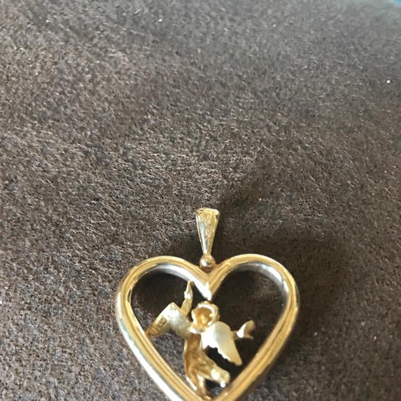 Jewelry - 14 carat gold heart with angel in middle. Jewelry - 14 carat gold heart with angel in middle.